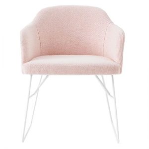 Pink armchair with white metal legs. Modern home furniture.