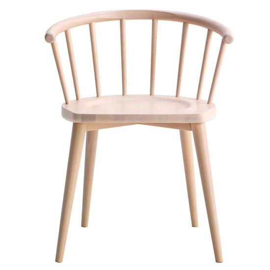 Light wood armchair with spindle back. Modern wooden chair with curved backrest.