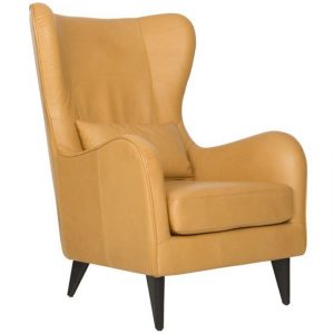 Greta armchair in tan leather. Wingback chair with cushion and dark wood legs. Modern furniture.