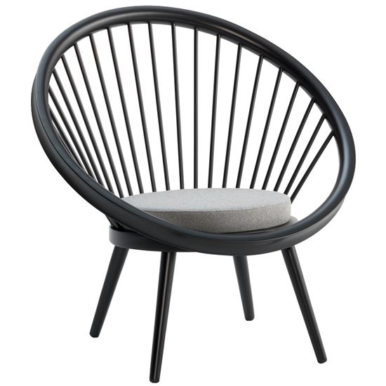 Angled view of the Loto lounge chair. Black wood frame with a gray upholstered seat.
