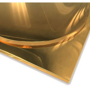 Close-up of a polished metal brass table top with light reflections.
