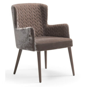 Front view of the Olga armchair in brown. Upholstered seat and back with a quilted pattern. Wooden frame and legs.