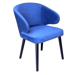 Upholstered Toffee armchair in blue velvet with a wooden frame and rounded armrests.