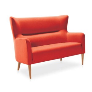 Upholstered Lino sofa in red fabric. Wood frame with tapered legs. Modern style, angled view.