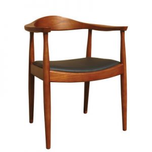 Front view of a Flight Walnut Armchair. The chair has a walnut-stained beech frame and a black upholstered seat pad.