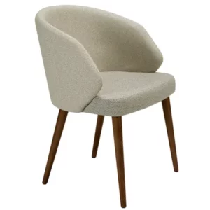 Angled view of the Alissa Armchair, featuring light upholstery and a wood frame. Stylish seating in various fabrics or leather.