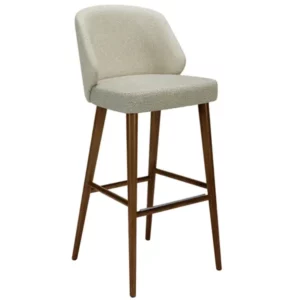 The Alissa barstool, showcasing a wooden frame with an upholstered seat and back in a light fabric. High stool elegance.