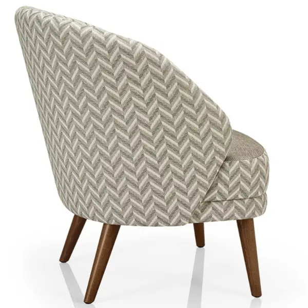 Angled view of the Alissa Lounge Chair featuring a patterned upholstery and wooden legs. Comfortable upholstered seating.