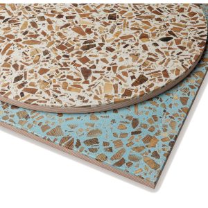Close-up of two Terrazzo Wood Table Tops, one round with a cream base, one square with a blue base.