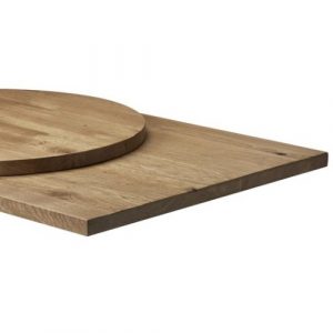Close-up of wood rustic antique oak table tops in round and square shapes.