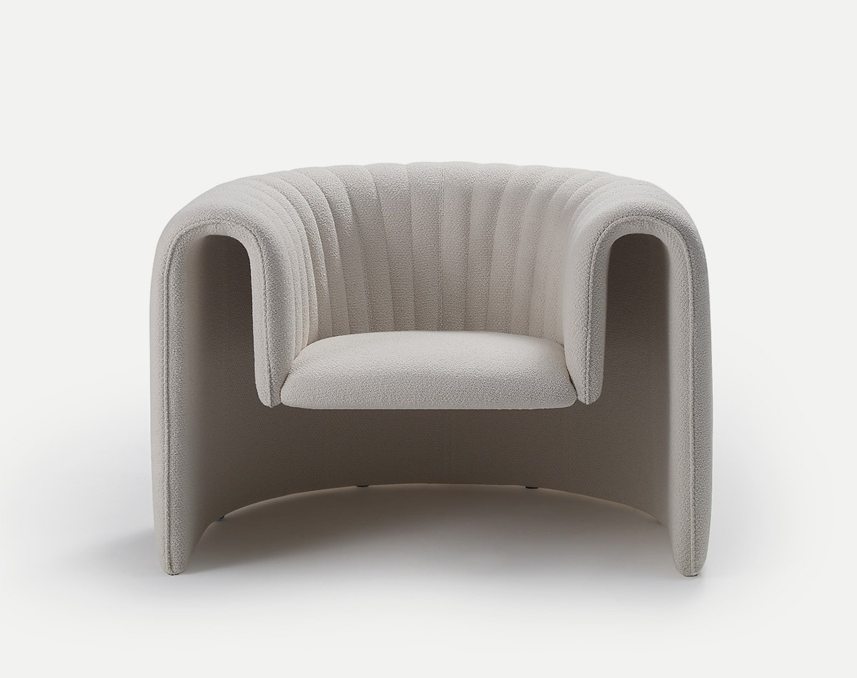 Front view of a light gray Remnant lounge chair with a curved, upholstered frame and seat.