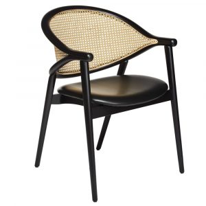 Umami cane armchair, front view. Black wood frame, cane back, and upholstered black seat.