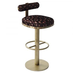 Le Tanque barstool with a metal frame and upholstered seat and back. The seat and back are a dark color with a light-colored pattern.