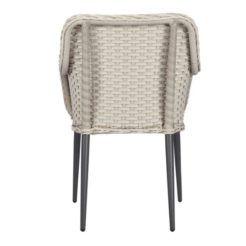 Back view of a light grey Bremen Armchair. It has a rattan weave backrest and a metal frame.