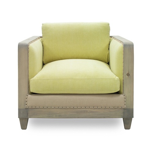 Front view of the Bambou lounge chair. It features a light wood frame and light green upholstered seat and back.