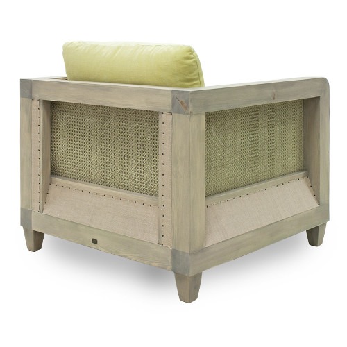 Angled view of the Bambou lounge chair showing wood frame, woven sides, and light green cushion.
