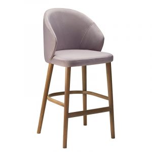 Upholstered Serene barstool in lilac. Wood frame, curved back, and footrest.