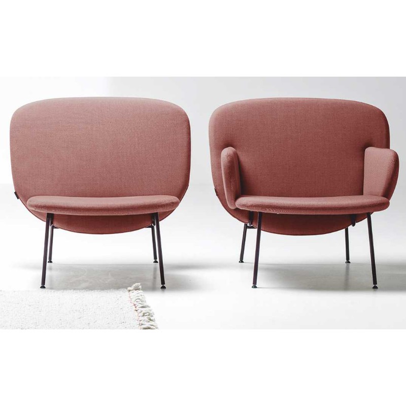 Two Ala lounge chairs, one with arms, in rose fabric with black metal frames.