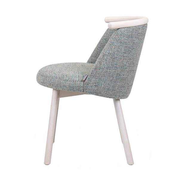 Side view of a Tape side chair. The upholstered seat and back are a textured light blue. The frame is white wood.