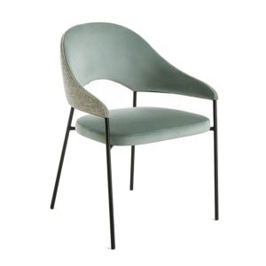 Upholstered Viena armchair in light green with black metal frame. The back of the chair is two-toned with a neutral fabric.