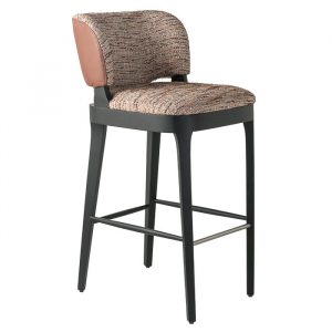 Upholstered Tea barstool with wooden frame. The seat and back are patterned, with a brown leather accent on the back.