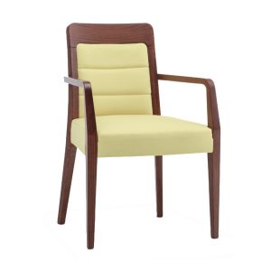 Front view of the Dora armchair. Wooden frame with light yellow upholstered seat and back.