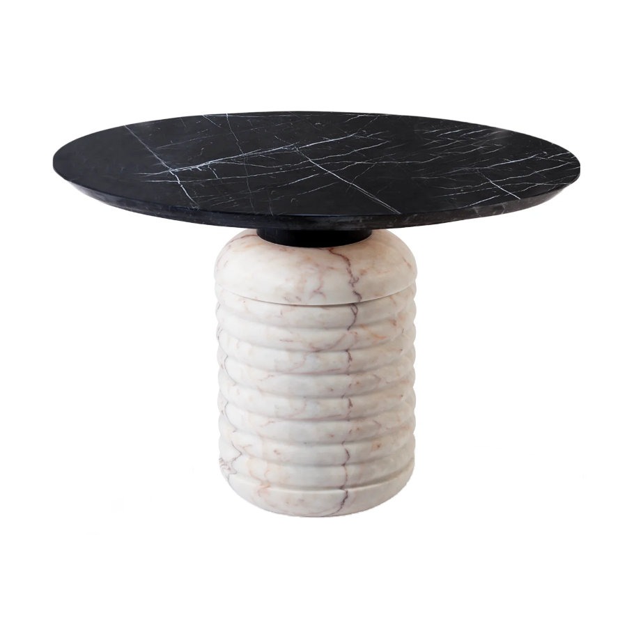 Jean dining table with a round Nero marble top and a ribbed, cylindrical base in Rosa marble.