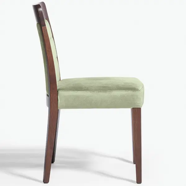 Side view of a Dora Side Chair, featuring a dark wood frame and elegant light green cushioned seat and backrest.