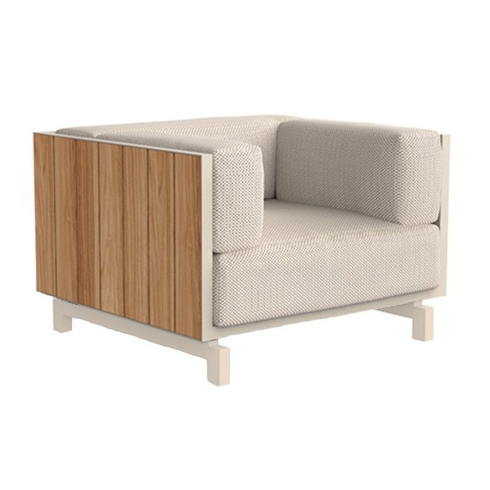 Vineyard lounge chair with light upholstery, teak wood panel, and a light metal frame.