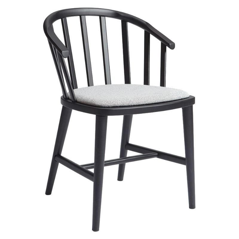 Front view of the Pantelleria armchair. Black wooden frame with a light gray upholstered seat.