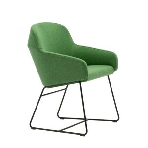 Upholstered green Aston armchair with a black metal frame, side view.