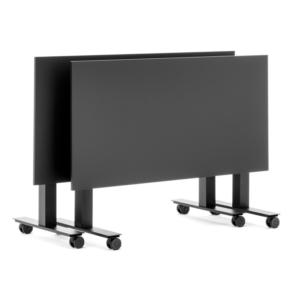 Two black Follow tilting tables with metal frames and castors.
