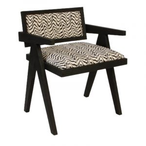 Angled view of the Janet armchair. Wood frame with upholstered seat and back in a zebra-like pattern.