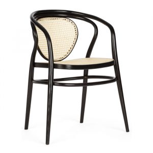 Front view of a Tokyo Armchair. The chair has a dark wooden frame with a woven cane seat and back.