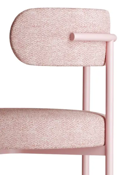 Detail shot of the Giotto side chair showing pink textured upholstery paired with a matching powder-coated metal frame.