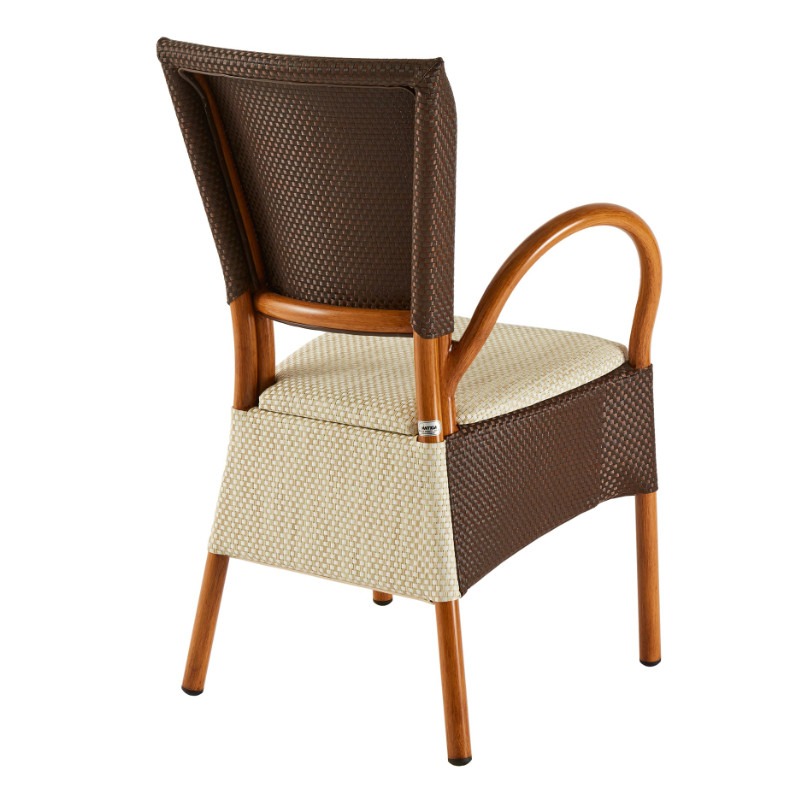 Rear view of a stackable Mister Armchair. Metal frame with brown and beige woven upholstery. Suitable for outdoor use.