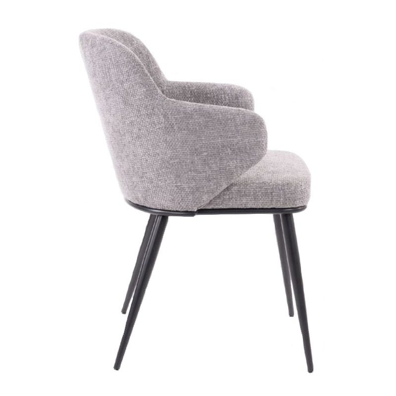 Side view of the Casey armchair. Upholstered in grey fabric with black metal frame and legs.