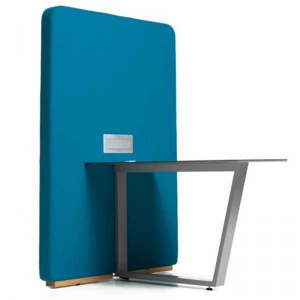 Angled view of a Circuit media table with a blue upholstered panel and a metal frame. The tabletop is laminate.