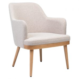 Front view of the Kelly armchair. Upholstered in off-white fabric with a wooden frame and legs.