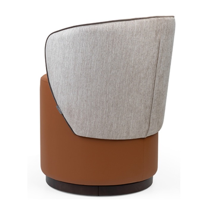 Back view of the Yana pouf. Upholstered in tan leather and light gray fabric with a dark brown trim.