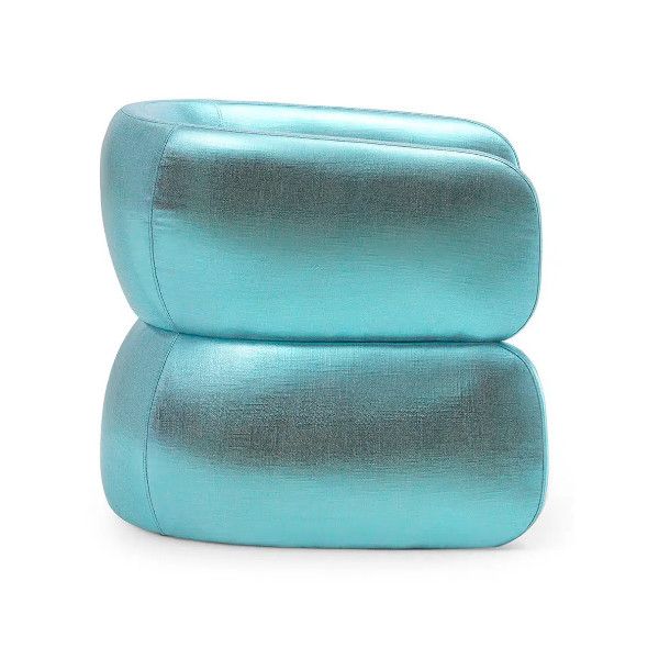 Upholstered Conrad lounge chair in metallic blue fabric. Stackable lounge furniture.