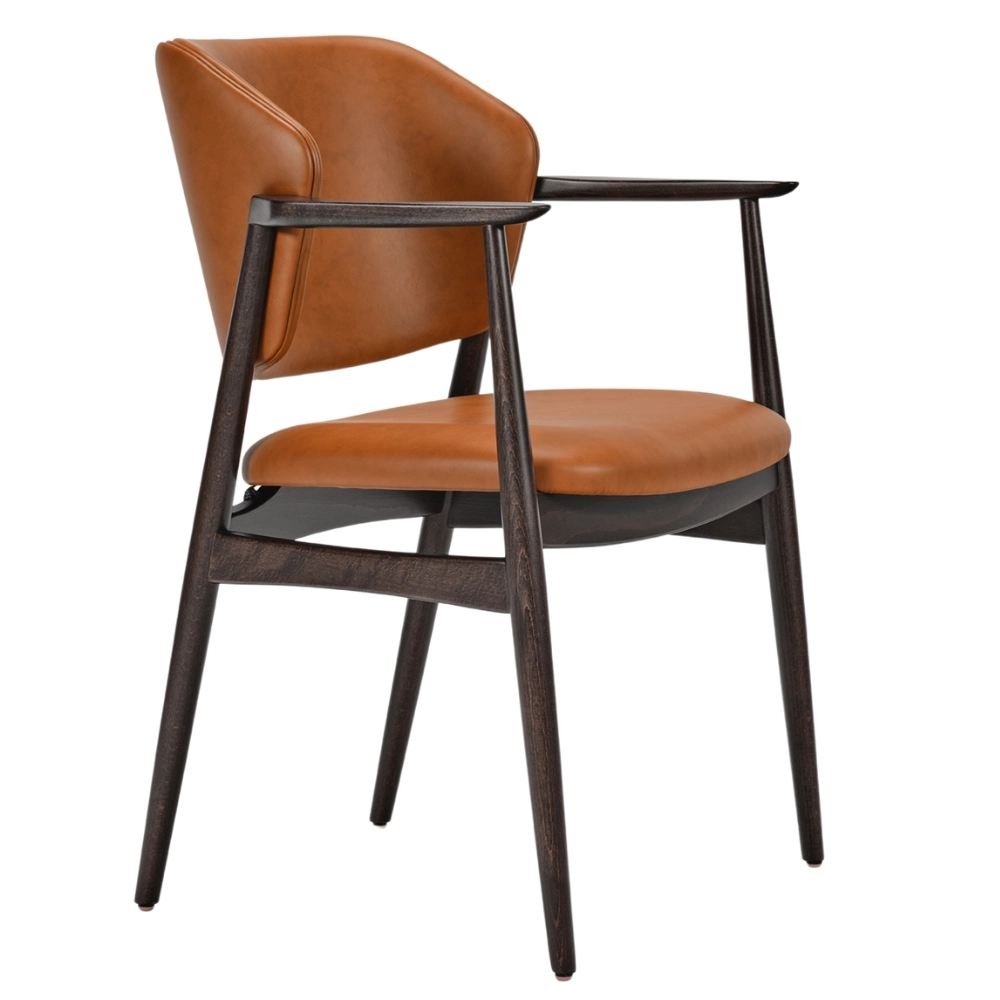 Three-quarter angle of a Silene armchair featuring a warm tan leather seat and a dark stained wooden frame.