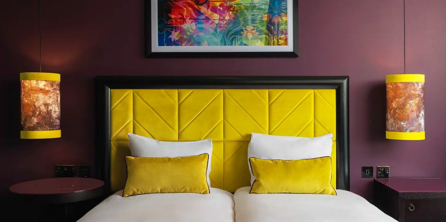 Bespoke contract hotel headboard in yellow, manufactured in the UK. Stylish bedroom interior at Malmaison Newcastle.