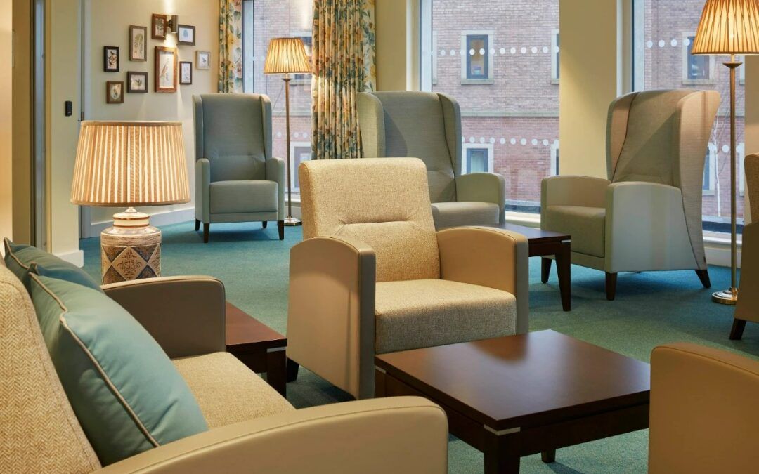 Comfortable health care furniture in a waiting area with chairs, sofas, and tables. Interior design.