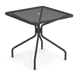 Metal Cambi dining table with square mesh top and parasol hole. Angled view.
