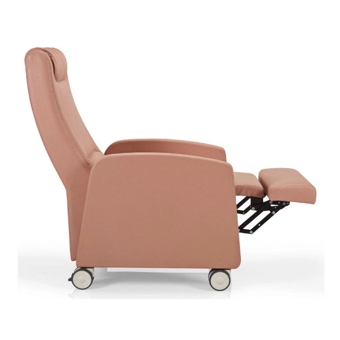 Side view of a pink upholstered Fedra high back lounge chair with extended footrest and wheels.
