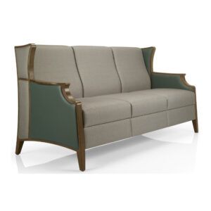 Angled view of the Janelle Deluxe 2 Seater Sofa. Wooden frame, upholstered in grey fabric with green leather accents.