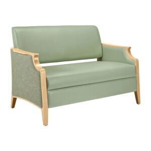 Front view of a light green Janelle sofa with light wood trim and patterned fabric on the side panels.