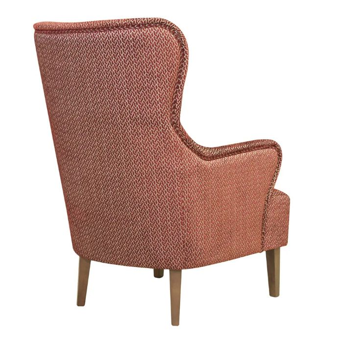 Rear view of a stylish Columbia Lounge Chair, upholstered in patterned red fabric with a classic wingback design and wooden legs.