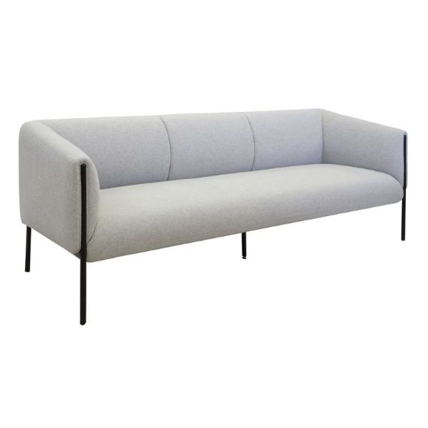 Angled view of a light gray Curve Lounge Chair with a black metal frame, ideal for modern offices and waiting areas.